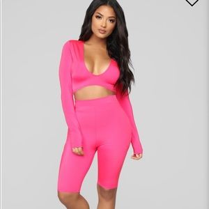 Long sleeve crop top and biker shorts.